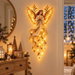 Angel Blessing Wall Light,Starglow Cascading Christmas Angel with Glowing. Available at Crazy Sales for $19.99
