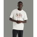 New Balance Athletics Relaxed Archive Walk Tee Sea Salt (108). Available at Platypus Shoes for $59.99