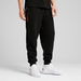 F1Â® ESS+ Men's Relaxed Sweatpants in Black, Size Medium, Cotton by PUMA. Available at Puma for $110.00