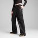WARDROBE ESSENTIALS Women's Relaxed Woven Cargo Pants in Black, Size XS, Polyester by PUMA. Available at Puma for $50.00